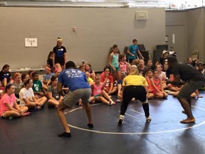 ATTHD Coaches Introduce Wrestling to Girls at Camp WIN